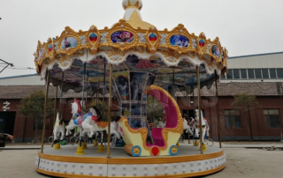 Dinis factory carousel ride in amusement park