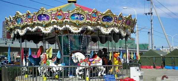 vintage merry go round ride in fairground